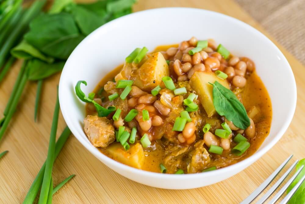 Vegetable,Stew,With,Meat,And,Potatoes,In,A,White,Bowl